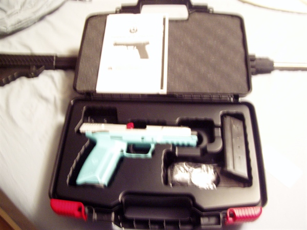 DISCONTINUED TALO EDITION RUGER-57 PISTOL SILVER SLIDE & TURQUOISE LOWER RECIVER $ 575.00