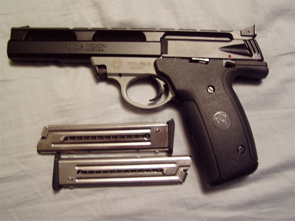 S&W 22A-1 semi auto. This is chambered in .22 LR and has an excellent bore. The barrel is 5 ½” long. The gun has been fired, like maybe one mag full. This was test fired on 12/09/10. This comes with t